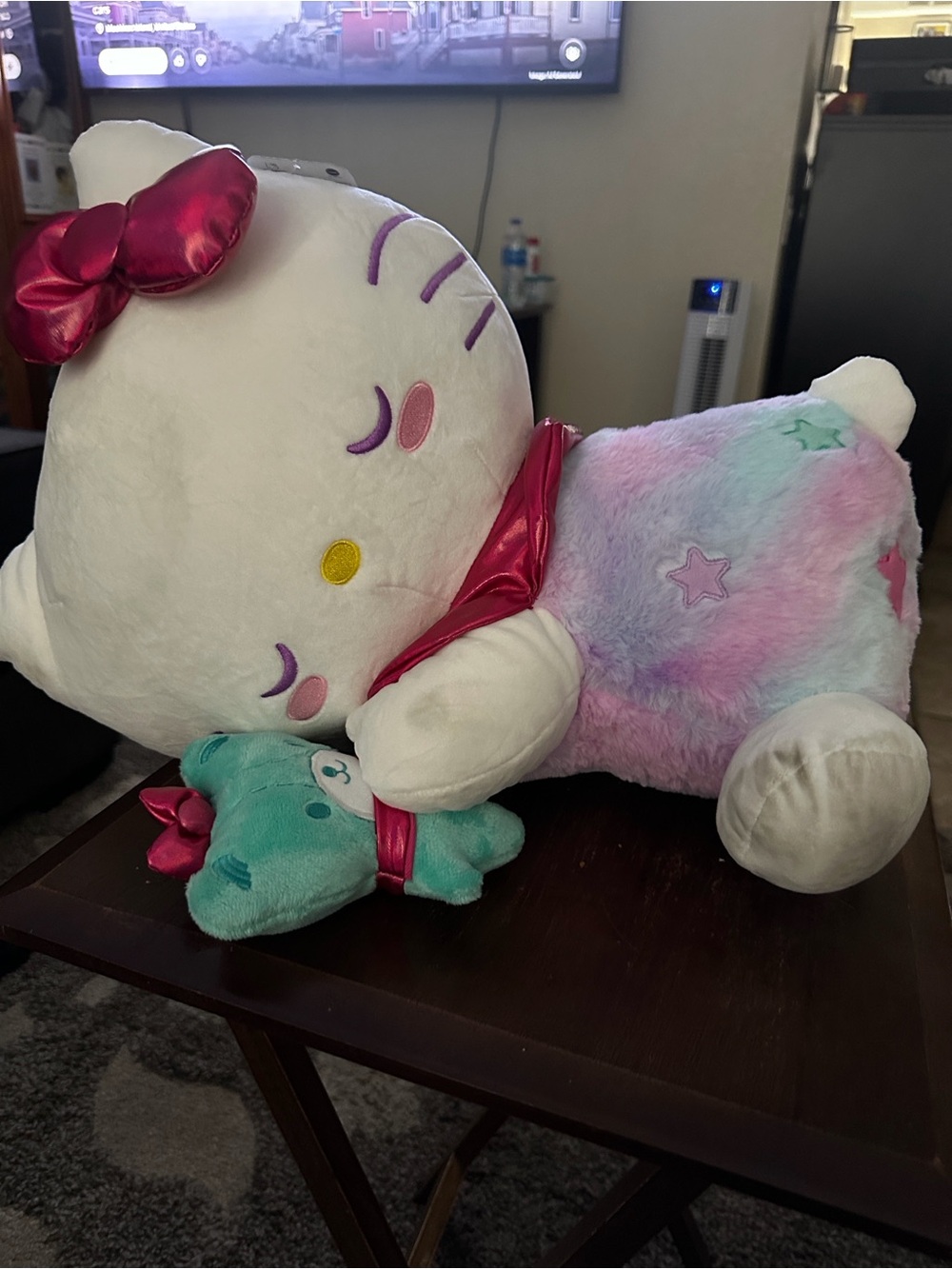 Hello Kitty Squishmallow Toy with Pink Bow and Pastel Rainbow Body